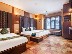Comfortable twin beds in grand Sonmarg suite.