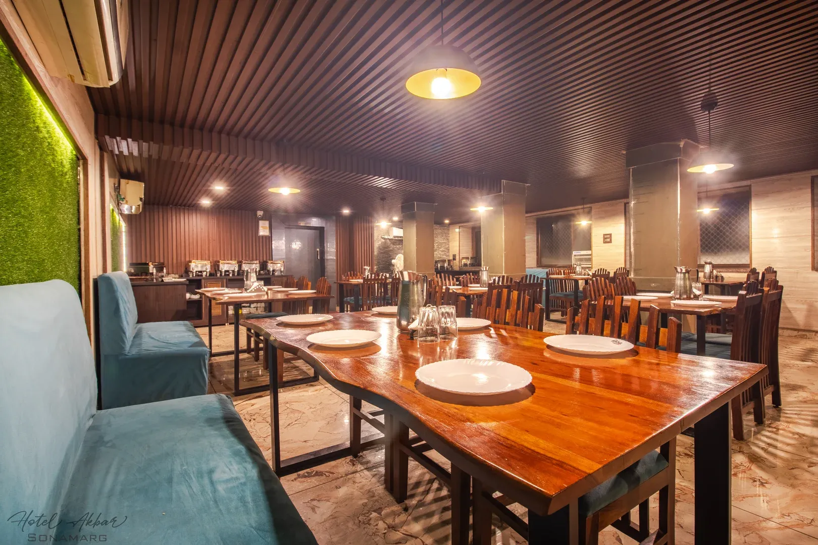 Elegant hotel restaurant with polished wooden tables.