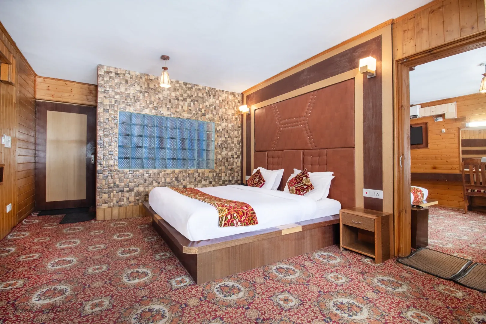 Luxurious Sonmarg hotel bedroom interior view.