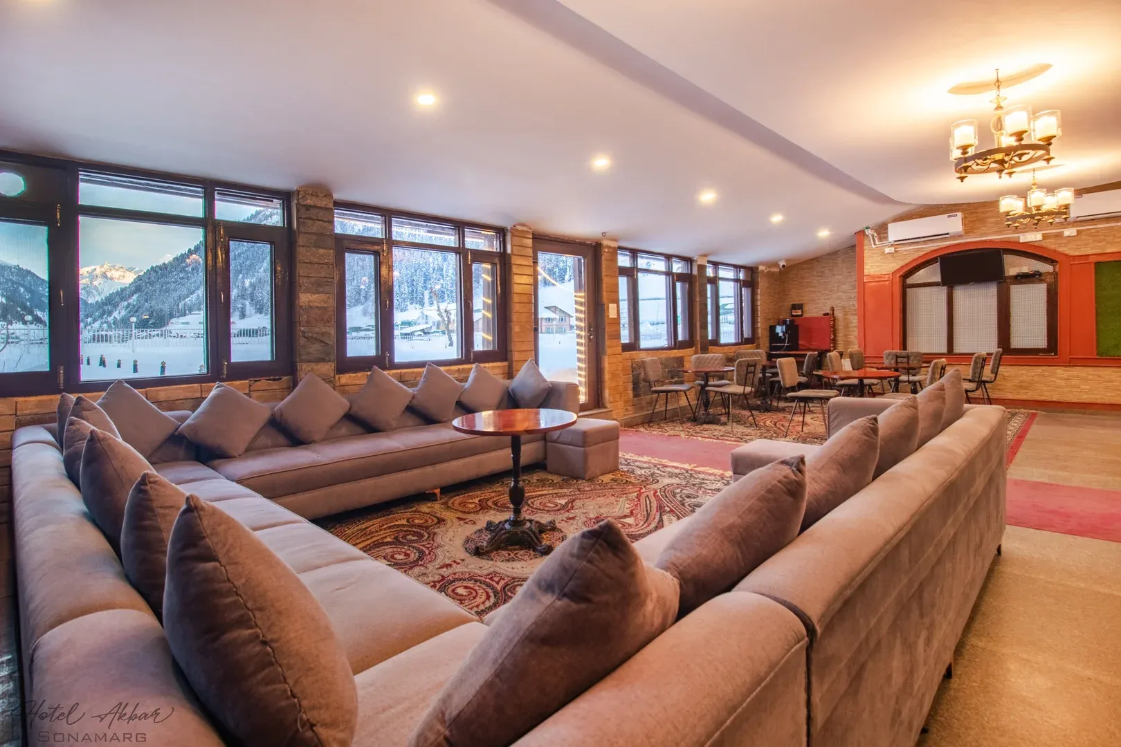 Luxury lounge overlooking snowy mountain views.