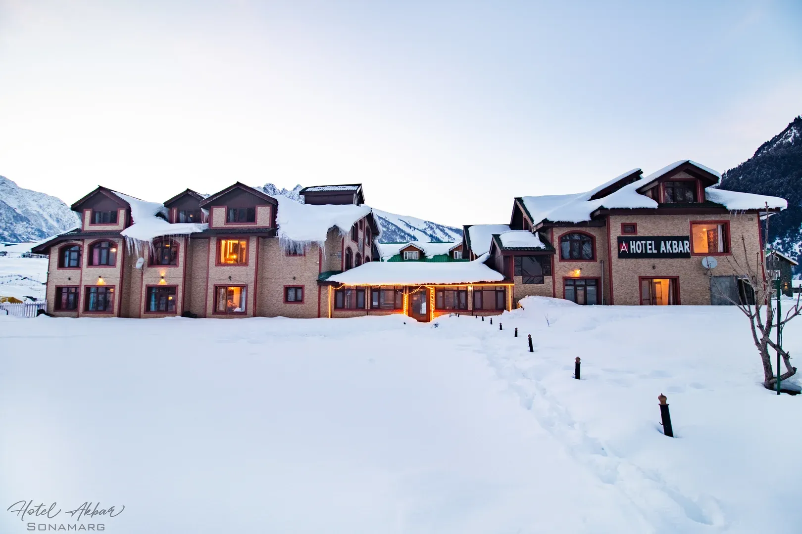 Luxury mountain hotel amid deep snow.