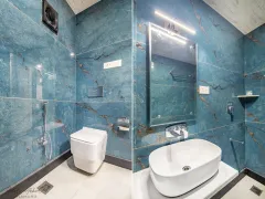 Modern blue marbled hotel bathroom amenities.